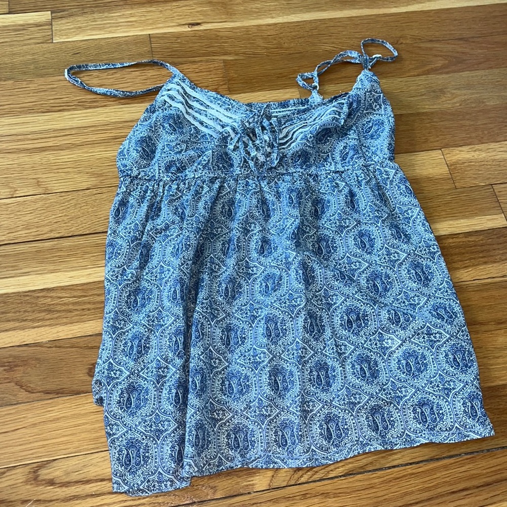 Blue tank top, with adjustable straps that is perfect for any occasion!!